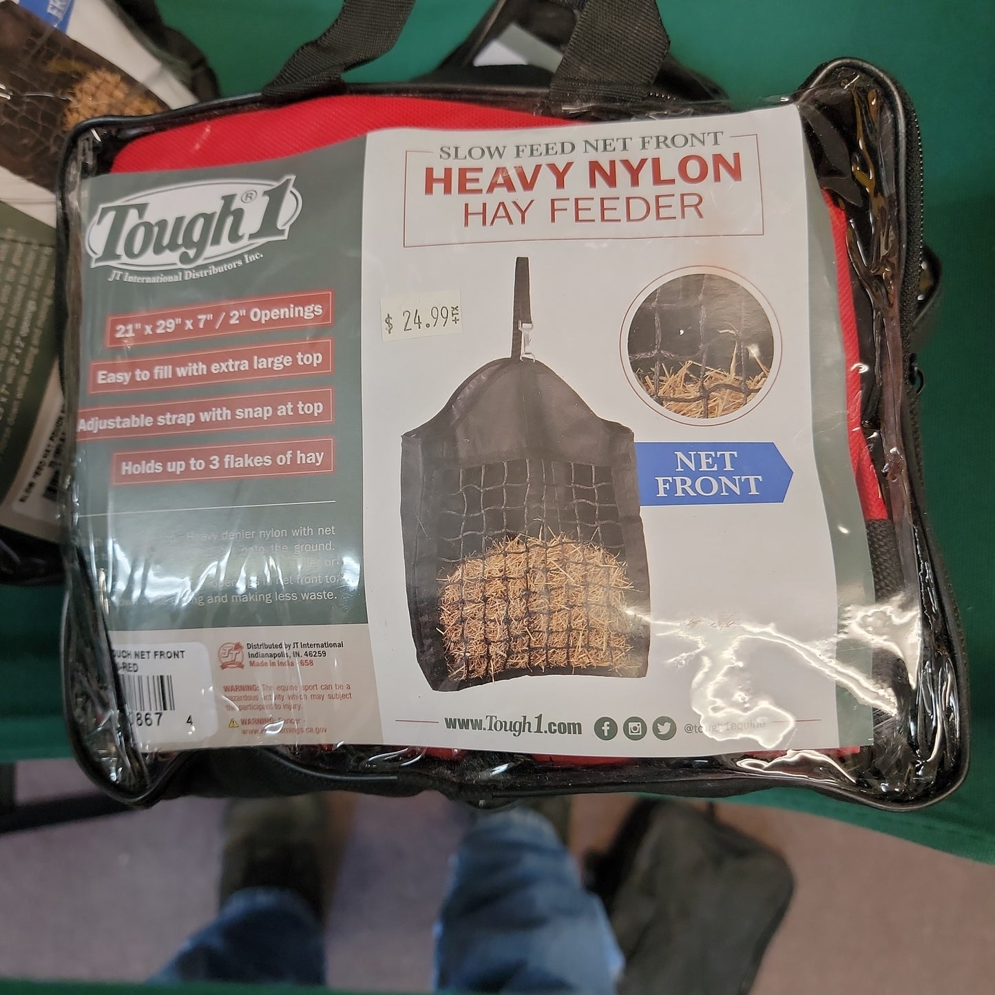 Slow feed hay feeder